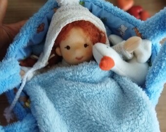 8'' inch handmade Waldorf mini doll. Comes with 3 different outfits,knitted cardigan set and a carrying bag. Ecofriendly natural cloth doll.
