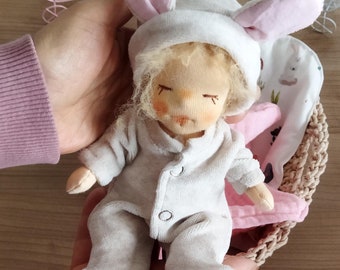 8'' inch handmade Waldorf doll. Comes with sleeping rompers, knitted cardigan set,bed and carrying bag. Ecofriendly natural cloth doll.