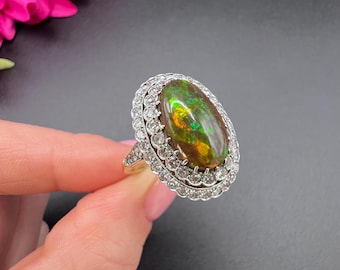 Vintage 18 kt goud en platina, decoratieve zwarte opaal en diamanten ovaalvormige clusterring