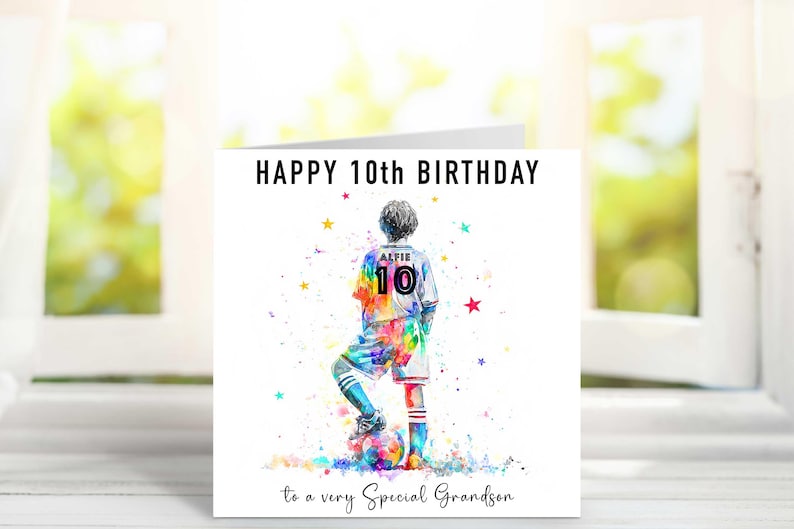 May include: A birthday card with a watercolor illustration of a soccer player in a colorful uniform. The card reads "HAPPY 10th BIRTHDAY" and "to a very Special Grandson". The player's jersey has the name "ALFIE" and the number "10".