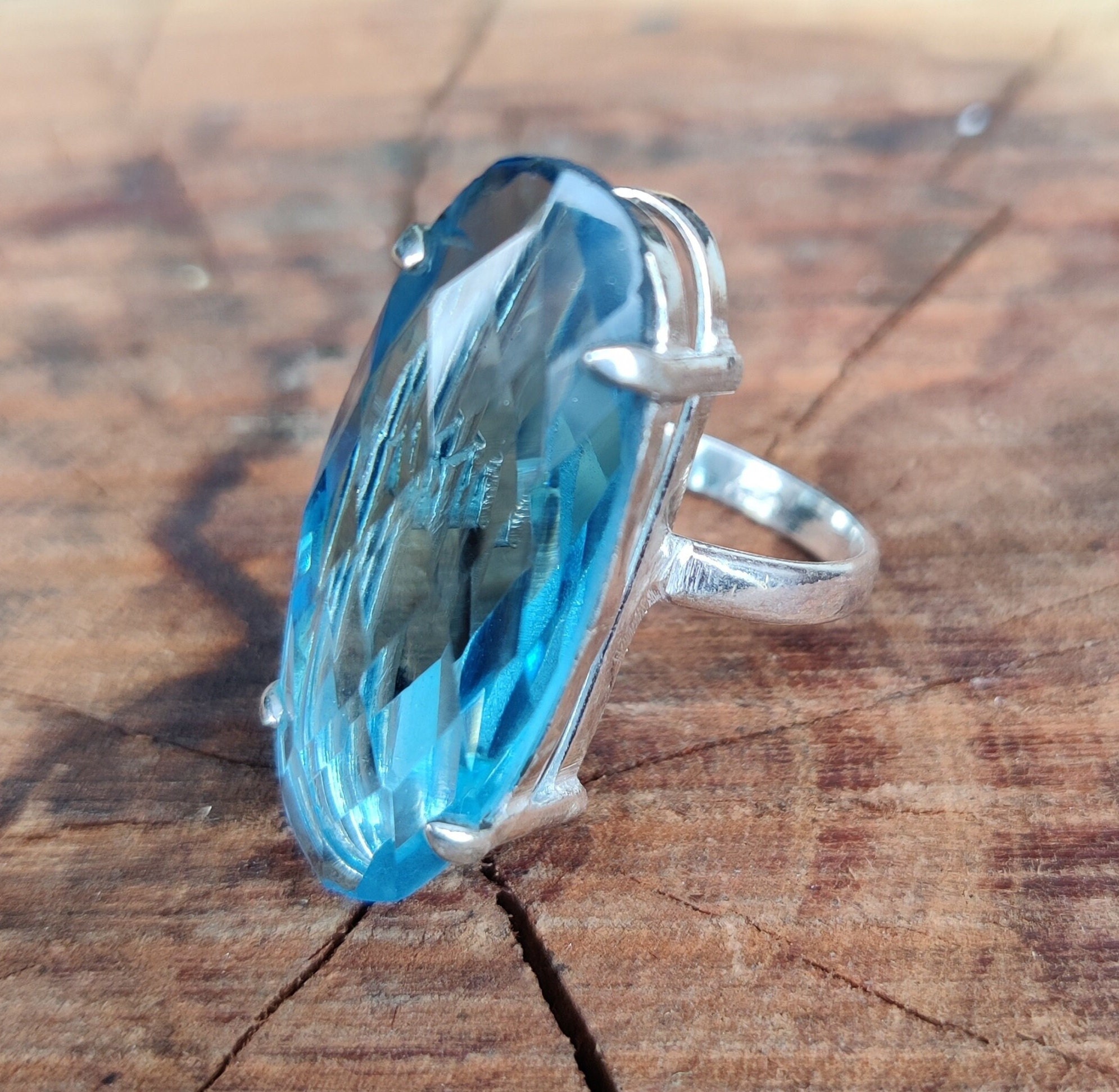 NOVICA Artisan Handmade Blue Topaz Cocktail Ring - .925 Sterling Silver, Bali Design, 1 Carat Teardrop Gemstone ('Gianyar Sunset')