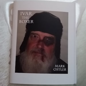 May include: A book cover with a black and white photo of a man wearing a black fur hat. The title of the book is "Ivar the Boxer" and the author is "Mark Ostler".