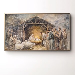 Könnte beinhalten: Ein gerahmtes Aquarellgemälde zeigt die Weihnachtsgeschichte. Das Kunstwerk zeigt Maria und das Jesuskind in einer Krippe, umgeben von Zuschauern, Schafen und einem rustikalen Stall. Die Farbpalette ist gedämpft mit warmem, goldenem Licht.