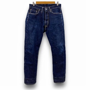 May include: A pair of dark blue denim jeans with a straight leg fit. The jeans have a button fly and five pockets.