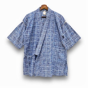 May include: Blue and white patterned kimono-style robe. The robe features a geometric design and short sleeves. It is hanging on a wooden hanger. The robe has a wrap-around design with a tie closure and two pockets.