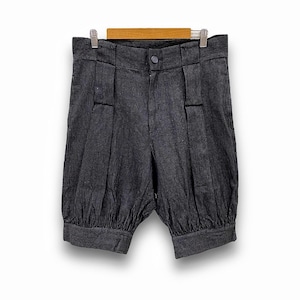 May include: Black and white striped shorts with a gathered elastic waistband and cuffs. The shorts have a relaxed fit and are made of a lightweight fabric.