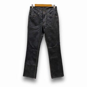 May include: Dark wash denim jeans with a straight leg fit and a subtle distressed look. The jeans have a light brown stitching detail.