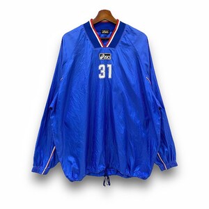 May include: A blue long-sleeved athletic jacket with the number 31 in white. The jacket has a V-neck collar with red and white trim, and the brand name "Asics" is visible. The jacket is hanging on a wooden hanger.