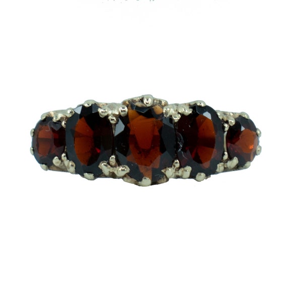 Five garnet gold ring