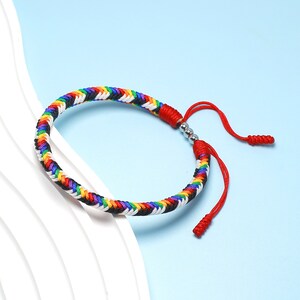 LAMIBEE Pride LGBTQAI+ Pride Love Wins - Pulseras tibetanas con cuerda de surfista LGBTQ para él y ella, mujeres y hombres, apoyo a la comunidad LGBTQ, Cobre, Ágata