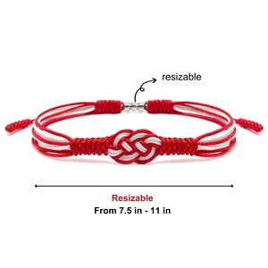 May include: Red and white braided bracelet with a silver slider to adjust the size. The bracelet is adjustable from 7.5 to 11 inches.  The bracelet features a knot design.