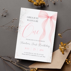 Puede incluir: Una invitaci&oacute;n de primer cumplea&ntilde;os rosa y blanca con un lazo de acuarela y el texto "Girls Just Wanna Be One" y "Amelia's First Birthday". La invitaci&oacute;n incluye la fecha, la hora y la informaci&oacute;n de RSVP.