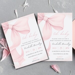 May include: Two baby shower invitations with a watercolor design. Each invitation features a large pink bow, the words "Oh baby," and event details including the name "Rachelle Brandry," date, time, and RSVP information.