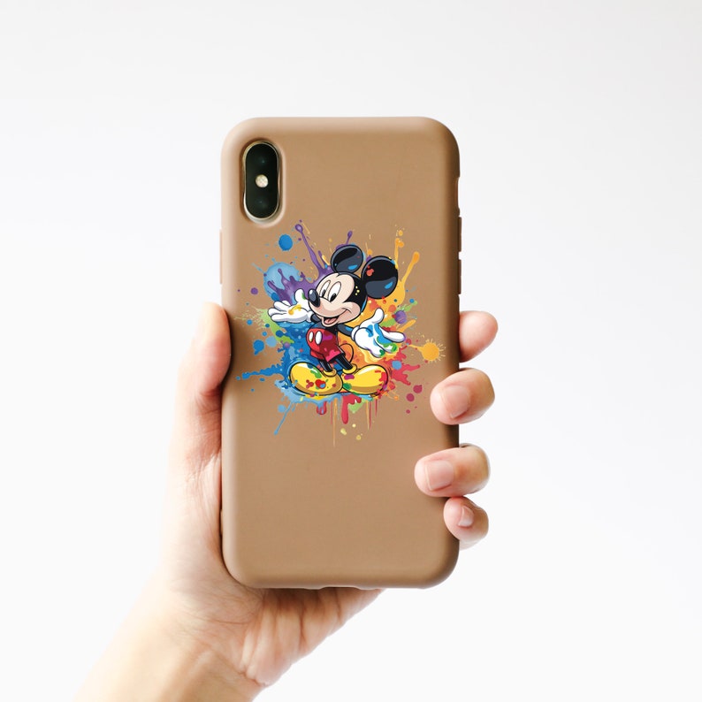 May include: A brown phone case with a colorful paint splatter design featuring Mickey Mouse in the center.