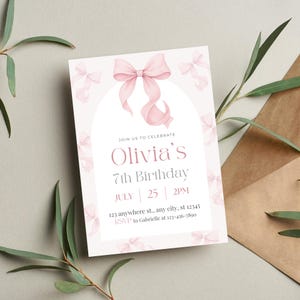 May include: A light pink birthday invitation with a large bow and smaller bows as accents. The invitation reads "Olivia's 7th Birthday" with the date and time. The RSVP information is at the bottom.