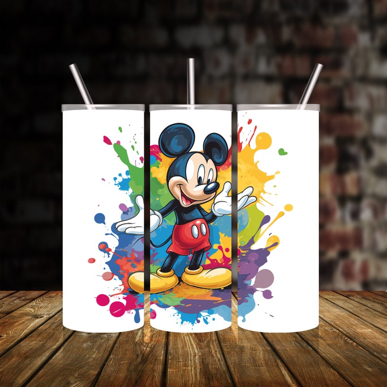 May include: Three white stainless steel tumblers with a colourful paint splatter design and a cartoon image of Mickey Mouse in the centre.