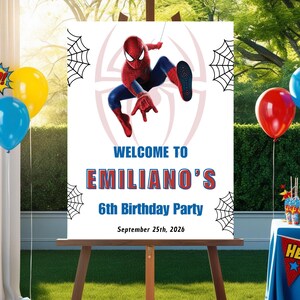 Op de afbeelding: Een wit bord op een ezel met een Spider-Man thema. Op het bord staat "WELCOME TO EMILIANO'S 6th Birthday Party September 25th, 2026." De achtergrond heeft een Spider-Man afbeelding en spinnenwebben.