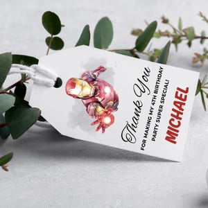 May include: White gift tag with a watercolor illustration of Iron Man. The tag reads "Thank You" in elegant script, with additional text: "FOR MAKING MY 4TH BIRTHDAY PARTY SUPER SPECIAL!" and the name "MICHAEL" in red.