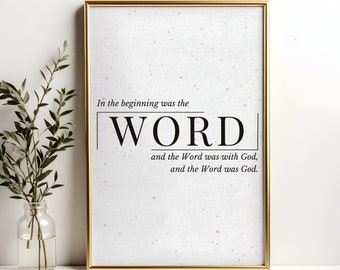 May include: A framed print with a white background and black text. The text reads "In the beginning was the WORD and the Word was with God, and the Word was God."