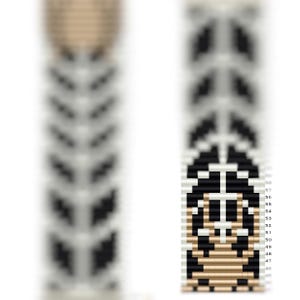 May include: A black and white beaded bracelet with a brown and white beaded design in the center. The bracelet is made with small, round beads and has a chevron pattern.