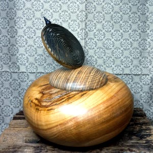 Beautiful turned box made of cherry wood and boxwood.