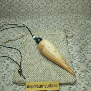 29 g. Ebony and yew. Rare pendulum for dowsing, spring, divination, geobiology.