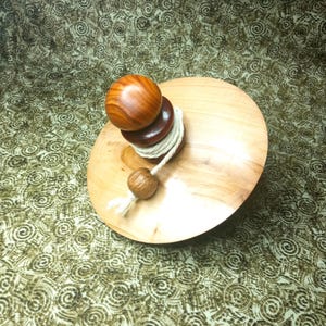 Beautiful large customizable string spinning top made of apple, plum and yew wood. Unique piece of very fine craftsmanship.