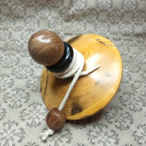 Beautiful large customizable string spinning top made of boxwood, black walnut and ebony. Unique piece of very fine craftsmanship.