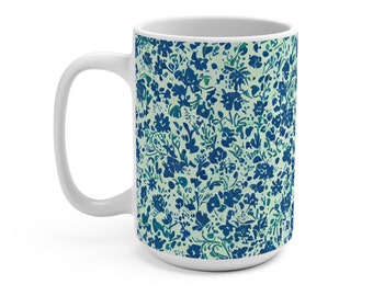May include: White ceramic mug with a blue and green floral pattern. The mug has a large handle and is 15 ounces.