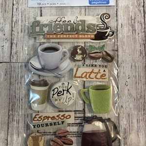 May include: A package of 3D coffee-themed stickers. The stickers include images of coffee cups, coffee beans, and phrases like "Coffee & Friends" and "Espresso Yourself." The stickers are in various colors, including brown, green, and white.