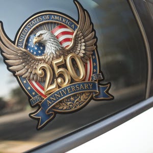 May include: A detailed decal featuring a golden eagle with outstretched wings, the American flag, and the text "250 Anniversary 1776-2026 United States of America." The design is in gold, red, white, and blue.