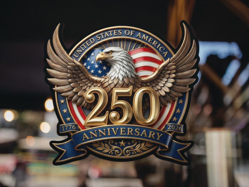 May include: A patriotic emblem celebrating the 250th anniversary of the United States of America. Features a golden eagle with outstretched wings, the American flag, and the text "250 Anniversary 1776-2026" in gold and blue.