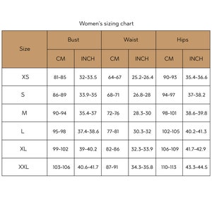 May include: A sizing chart for women's clothing with measurements in inches and centimetres. The chart shows the size, bust, waist, and hips measurements for sizes XS to XXL.