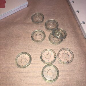 May include: Eight clear plastic binder clips with a heart-shaped cutout and glitter embedded in the plastic.