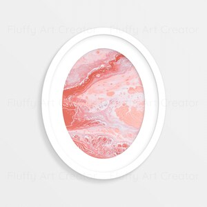 May include: A white circular frame with a pink and white abstract painting inside. The painting has a swirling, marbled effect.