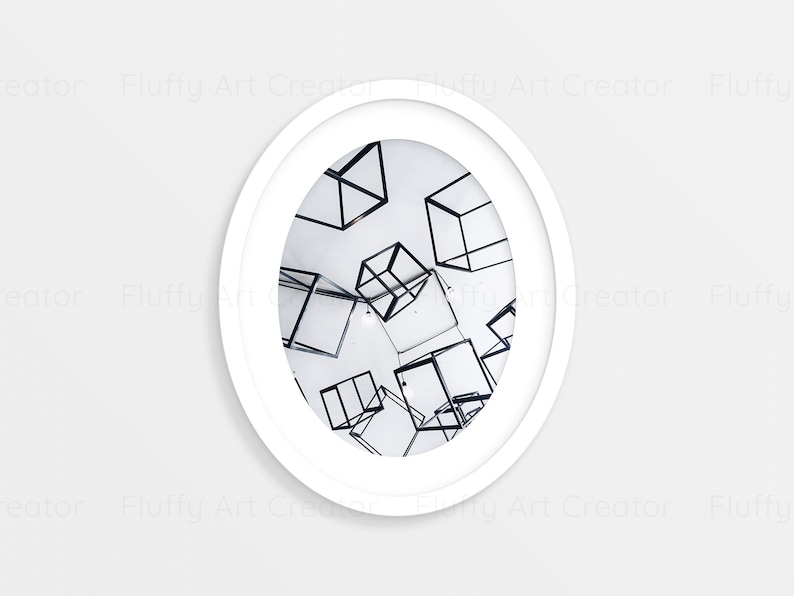 May include: A white framed photograph of a white room with black wire cubes hanging from the ceiling.