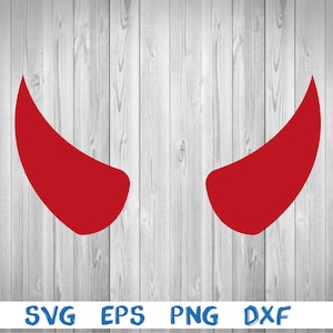 Puede incluir: Dos cuernos de diablo rojos sobre un fondo de madera blanca.