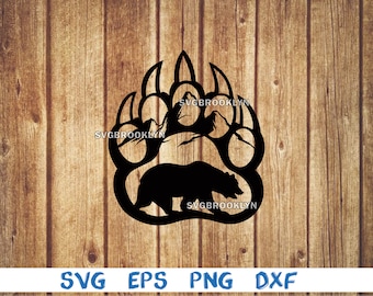 May include: Black silhouette of a bear paw print with mountains inside the print and a bear walking below the print. The text "SVGBROOKLYN" appears three times in the image.
