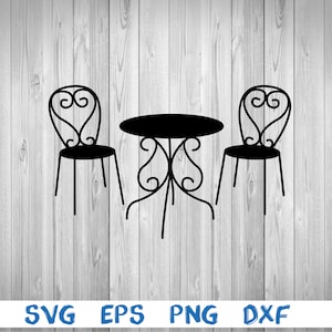 May include: Black metal outdoor table and two chairs with ornate designs. The table and chairs are set against a wood grain background.