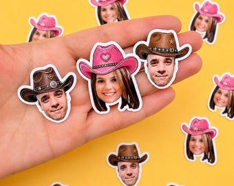 May include: A collection of die-cut stickers featuring individual portraits of two different people wearing cowboy hats. One person wears a bright pink cowboy hat with a heart detail, and the other wears a brown cowboy hat with a star emblem.