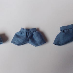 May include: Three pairs of blue denim shorts in different sizes. The shorts are made of a soft, lightweight fabric and have a casual, relaxed fit.