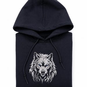May include: Navy blue hooded sweatshirt with an embroidered wolf head. The wolf has silver fur and blue eyes. The hoodie features a drawstring and a classic fit. The sweatshirt is a versatile item of clothing.