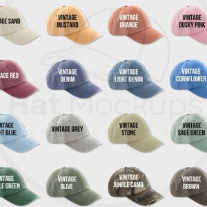 May include: A collection of vintage-style baseball caps in various colors, including sand, mustard, orange, dusky pink, red, denim, light denim, cornflower, light blue, grey, stone, sage green, bottle green, olive, jungle camo, and brown. Each cap features the word "VINTAGE" on the front.