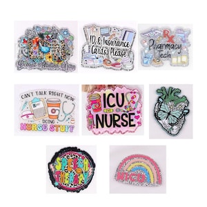 May include: A collection of glittery acrylic pins with various designs and text. The pins include phrases like "Licensed Practical Nurse," "ID & Insurance Cards, Please," and "Pharmacy Tech." Other pins feature medical-themed graphics and the words "ICU Nurse" and "Speech Therapy."