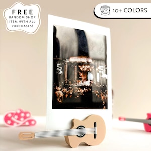Guitar shops film stand fujifilm camera picture learning to play guitar accessories framed photo gifted fujifilm instax pic. guitar for sale