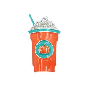 May include: Orange and teal enamel pin of a pumpkin spice latte with whipped cream and a straw.