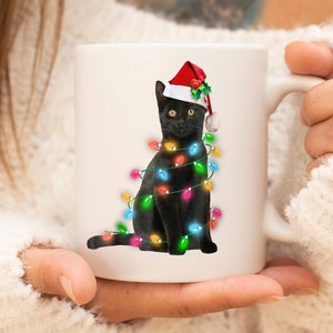 Black Santa Cat Mug, Santa Cat with Christmas lights Mug, Black cat mug, Cat lover mug, Cat Mug, Christmas gift, Christmas Cat mug gift