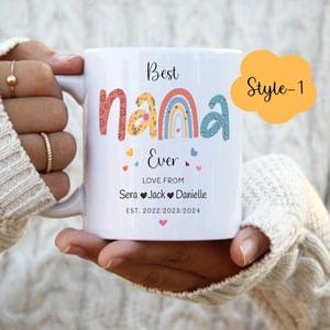 May include: White ceramic mug with a rainbow design and the text "Best Nana Ever" with hearts and the text "Love from Sera Jack Danielle Est. 2022/2023/2024". The mug has a yellow cloud with the text "Style-1" in the top right corner.