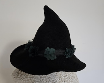 Fae wiches hat with green flowers trim.