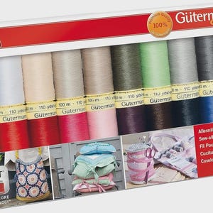 May include: A Value Pack of Gütermann sew-all thread spools in various colors. The package includes 100% premium quality thread, with each spool containing 110 yards. The box also features images of sewing projects.